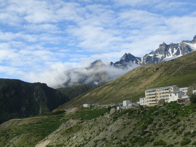 Mountain village with snow-capped peaks