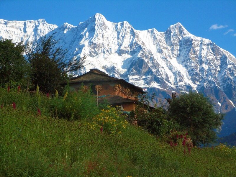 Mountain village with snow-capped peaks