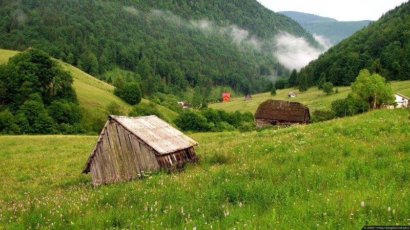 Mountain village with wooden huts