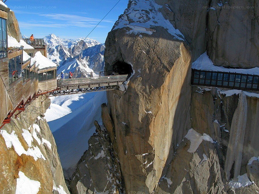 Mountain walkway with snowy peaks