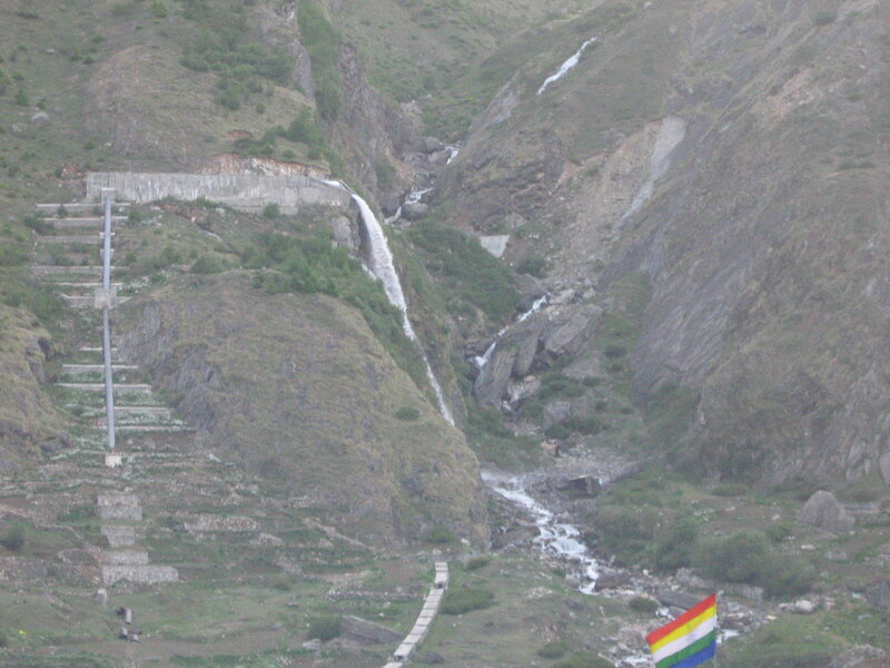 mountain waterfall and flag