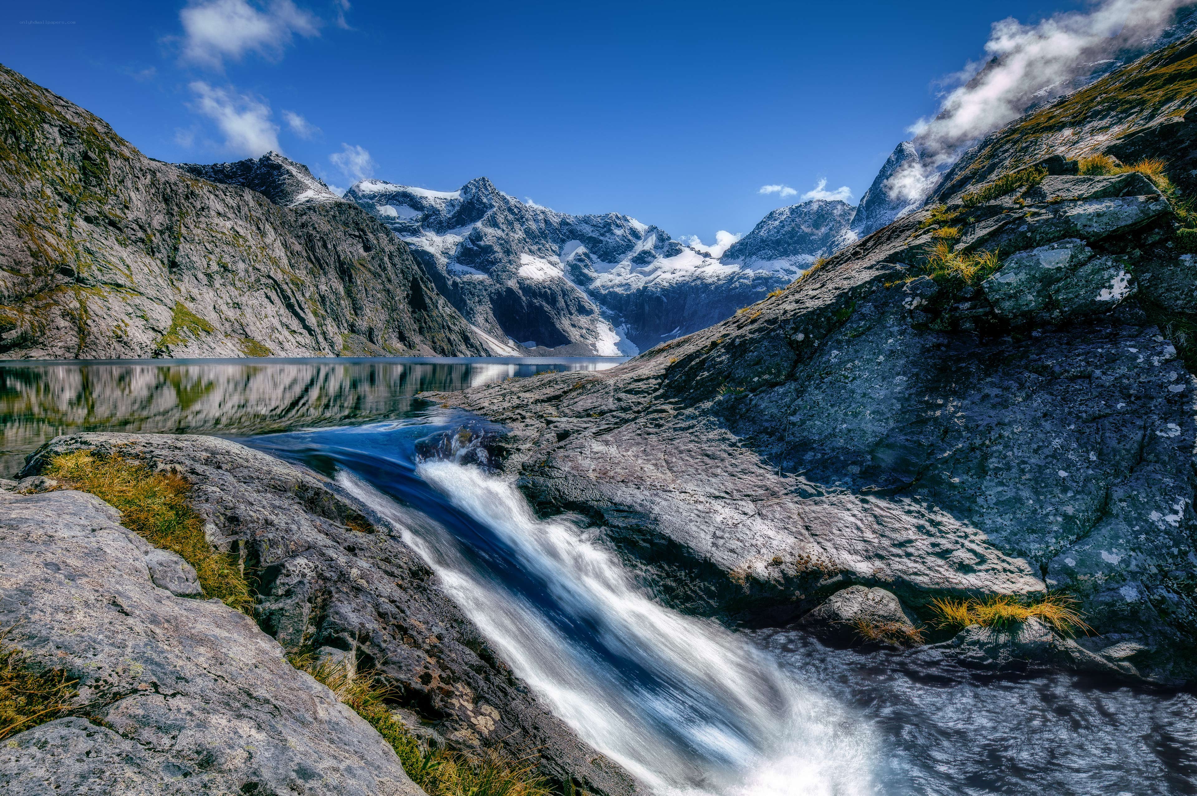 Mountain waterfall and lake