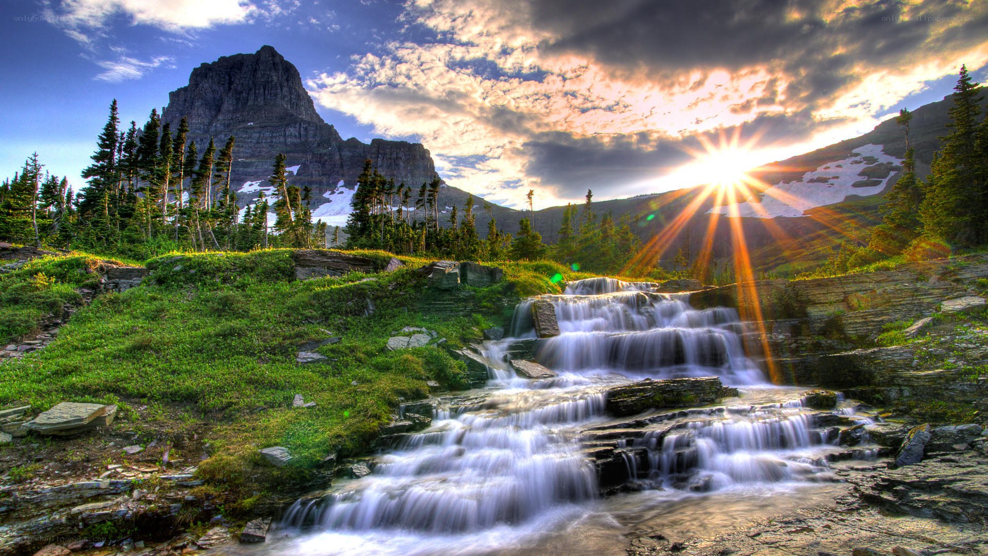 Mountain waterfall at sunset