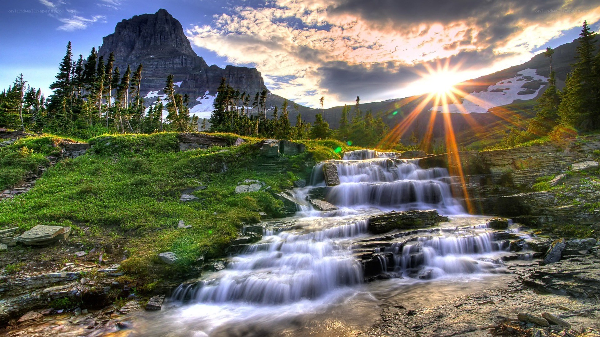 Mountain waterfall at sunset