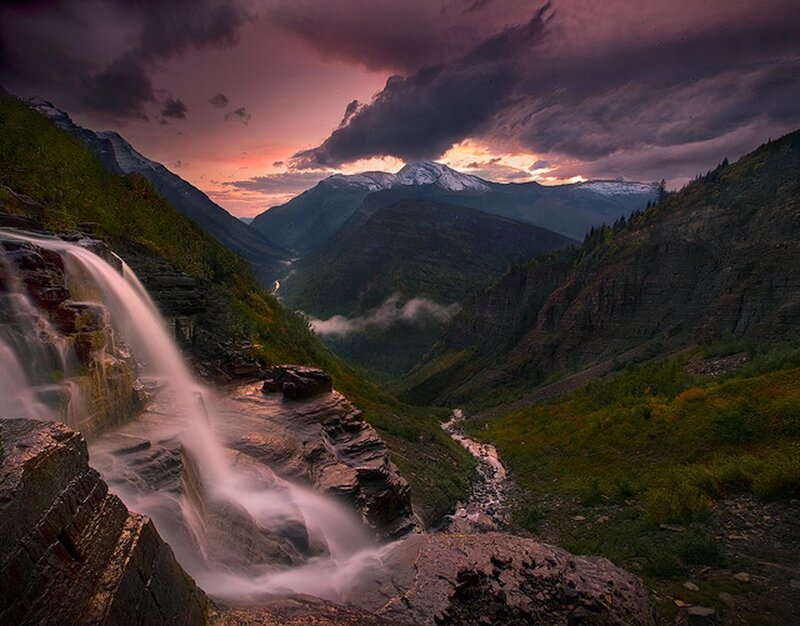 Mountain waterfall at sunset