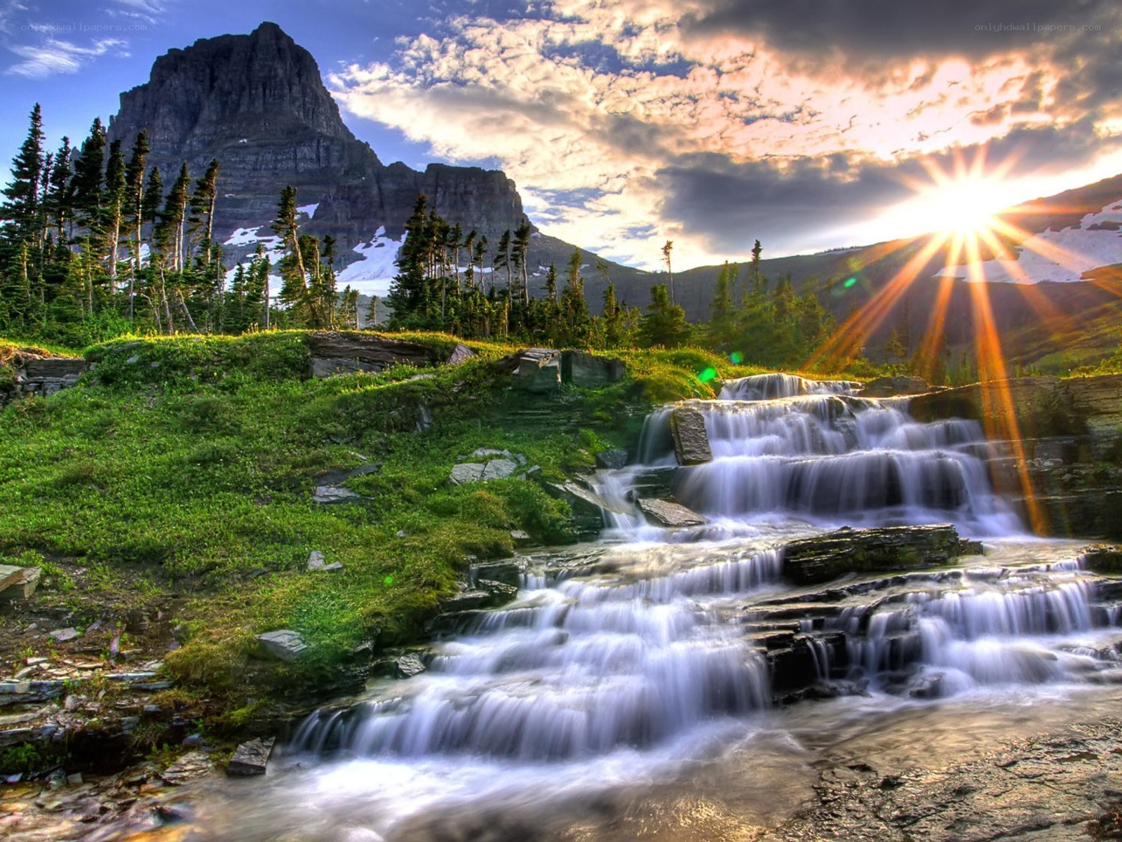 Mountain waterfall at sunset