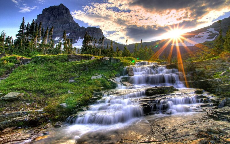 Mountain waterfall at sunset