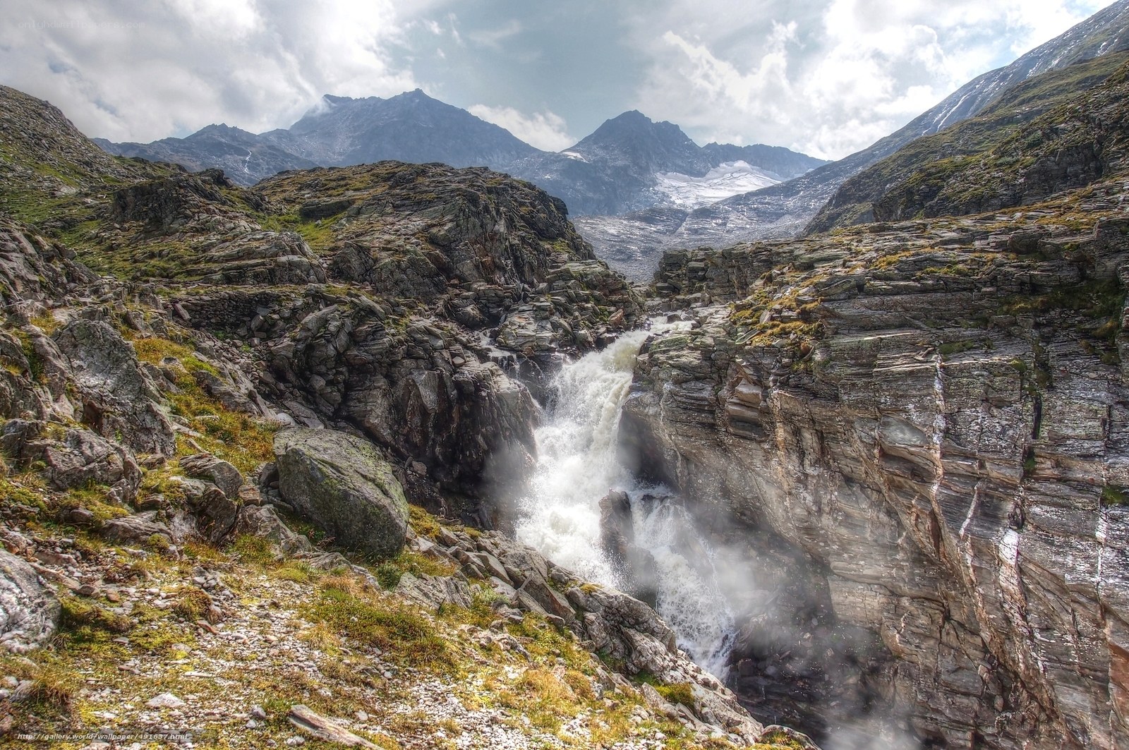 Mountain waterfall in a rocky canyon
