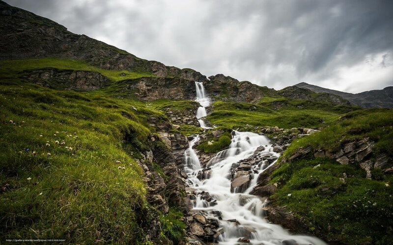 Mountain waterfall in green valley