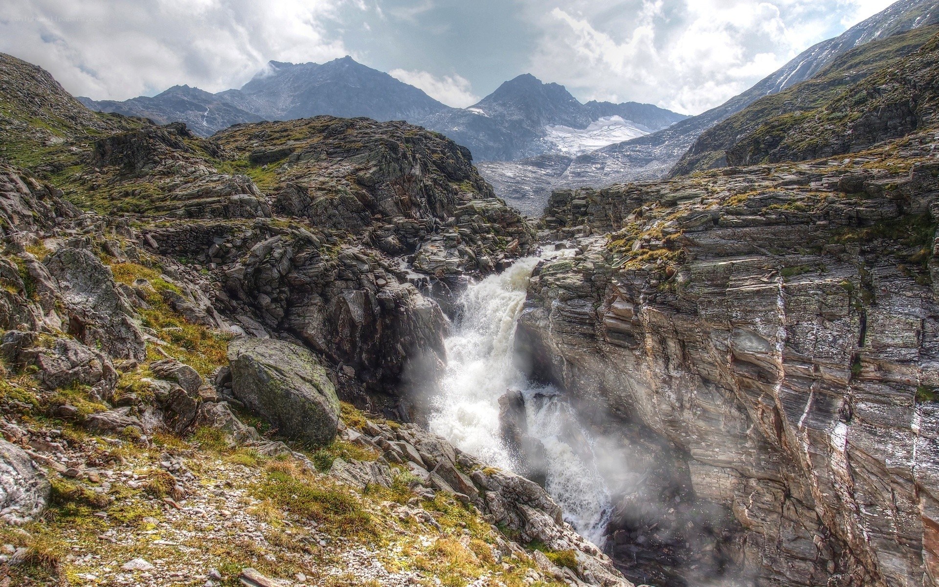 Mountain waterfall in rocky canyon