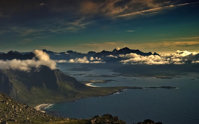 Mountainous coastal landscape at sunset