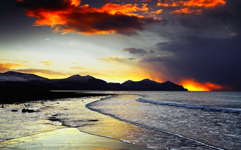 Mountainous Coastline at Sunset — Orange, Dramatic, Photograph
