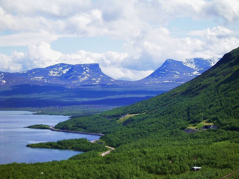 mountainous landscape with lake and road