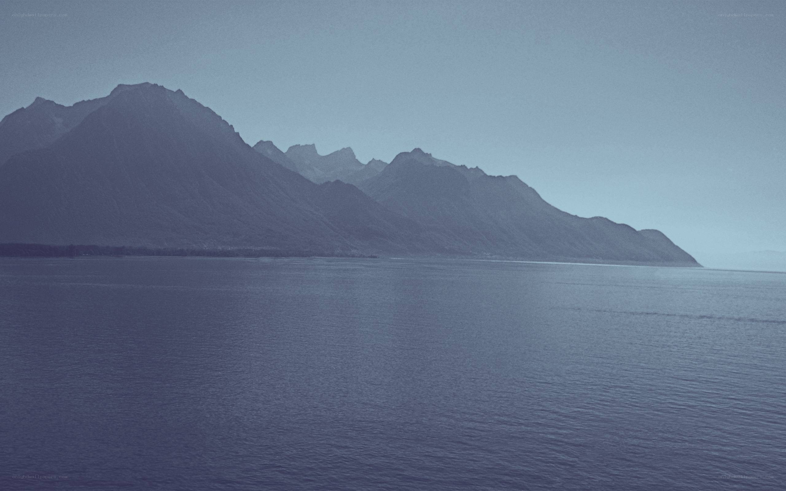mountains over a calm lake