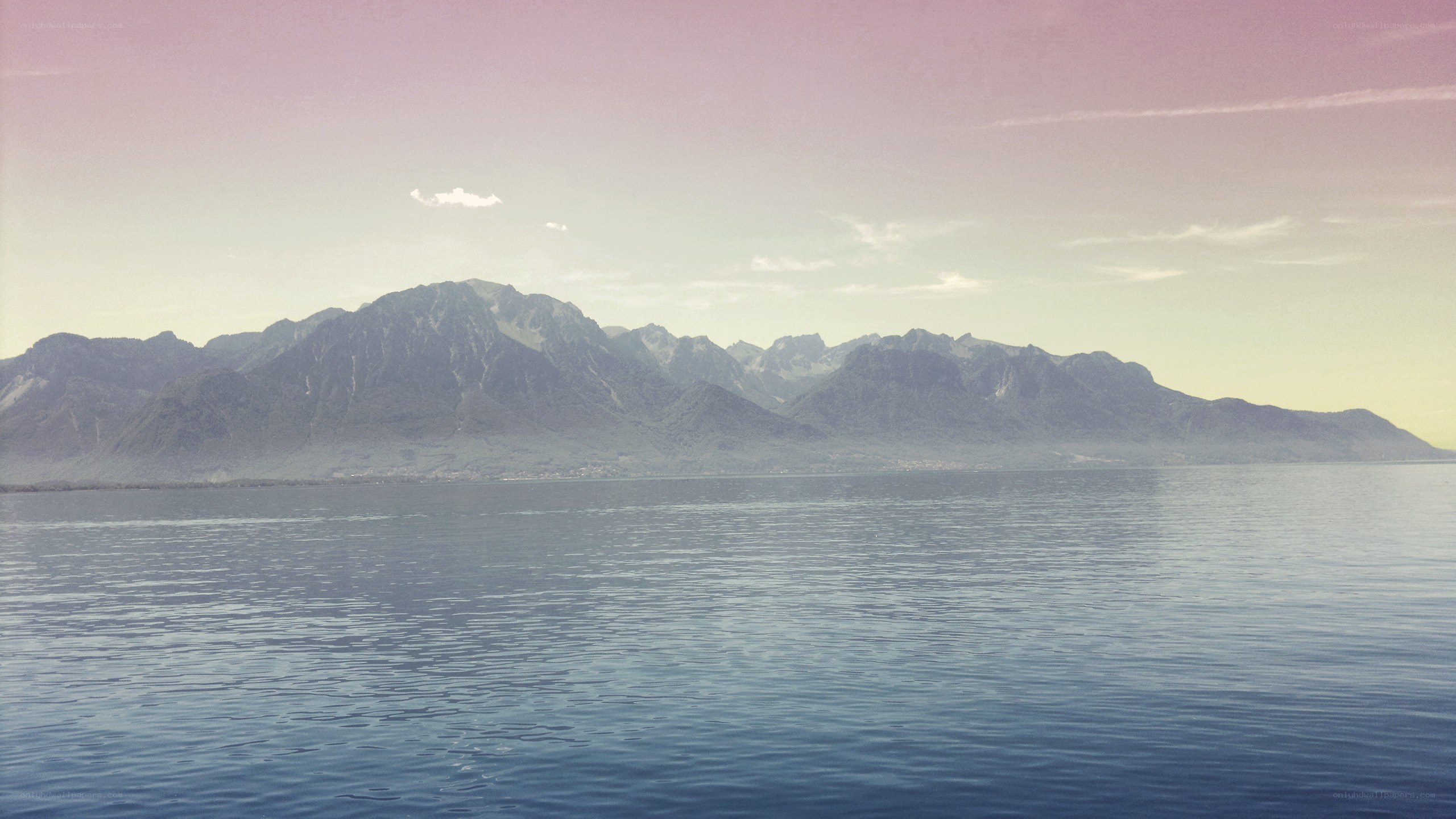 mountains over a calm lake