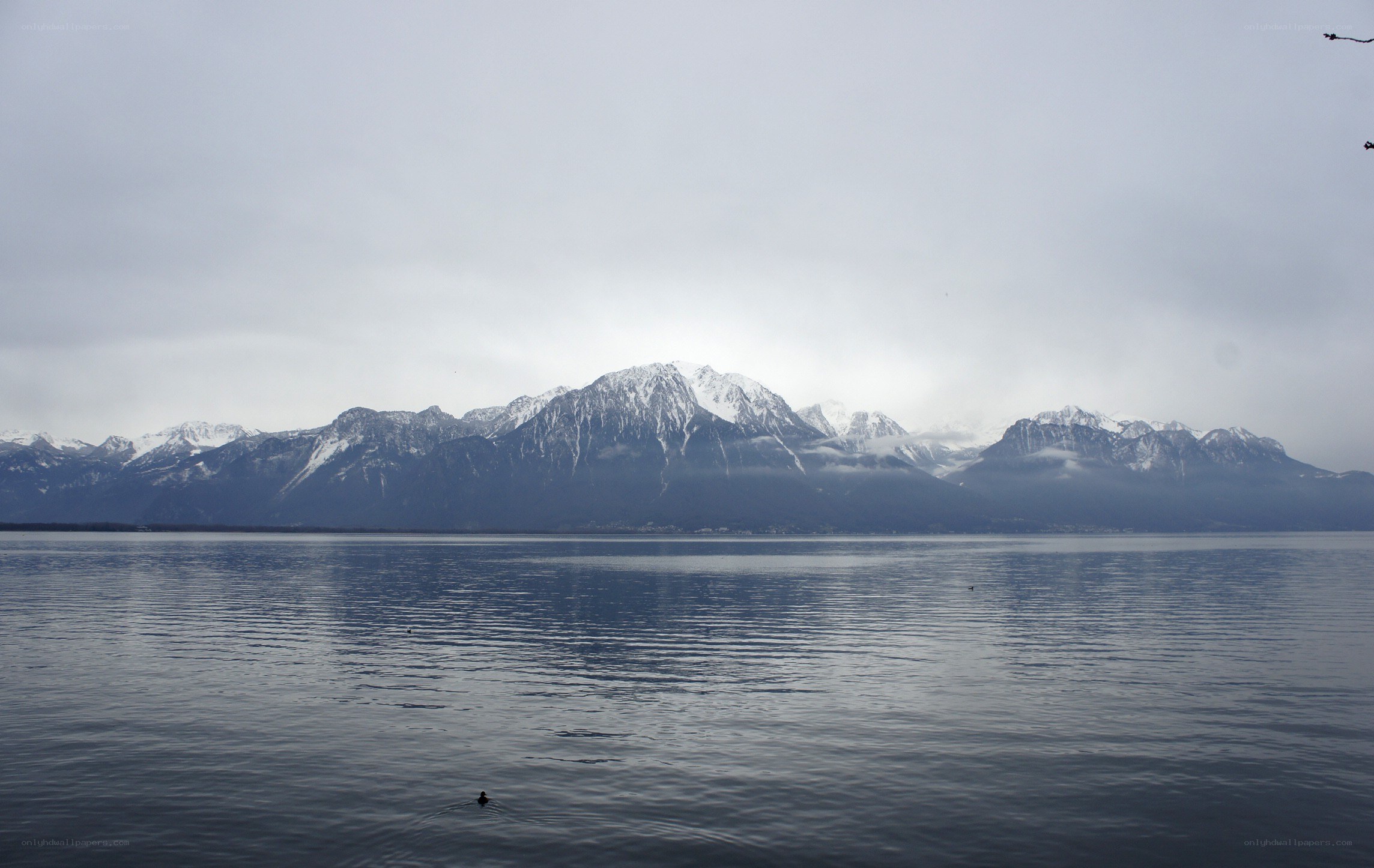 mountains reflected in a calm lake