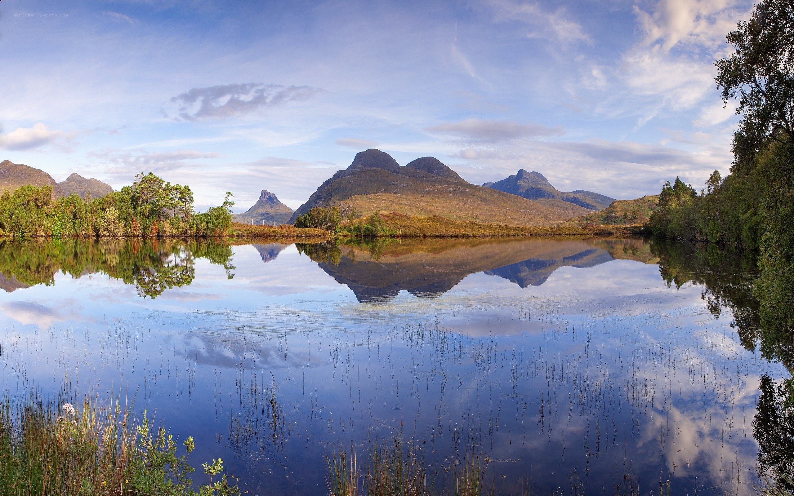 mountains reflected in a calm lake