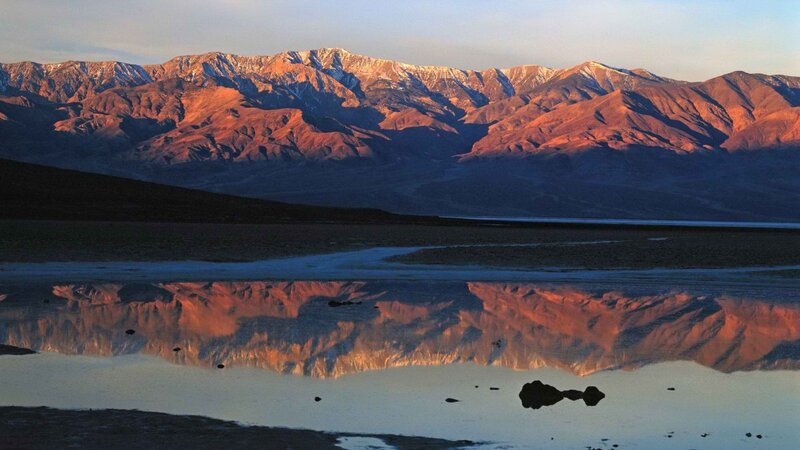 mountains reflected in water