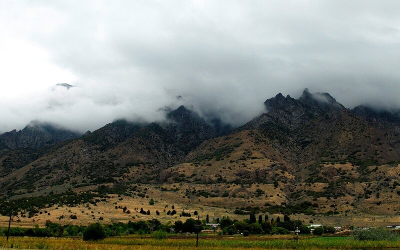mountains under cloudy sky