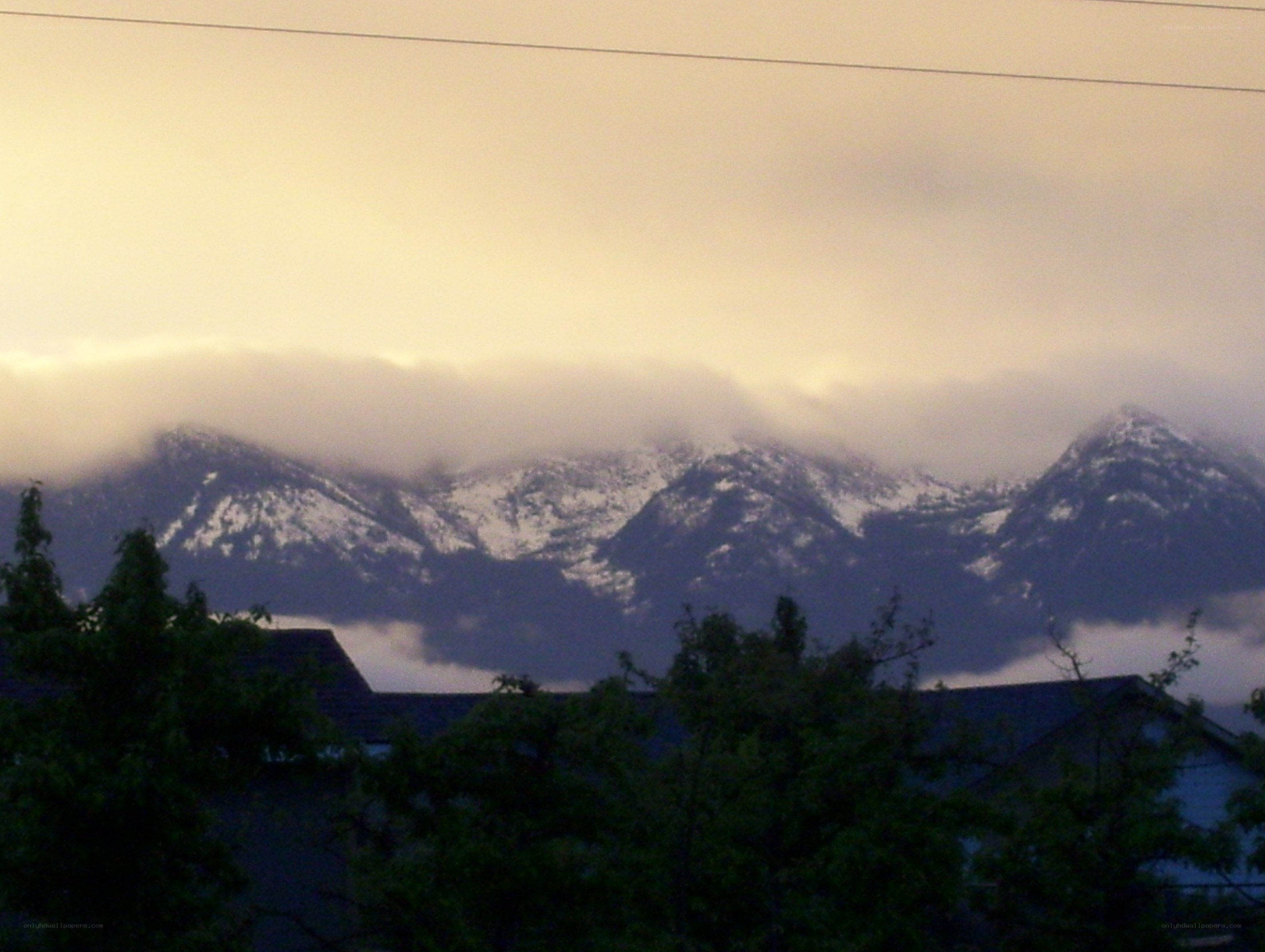 mountains under cloudy sky