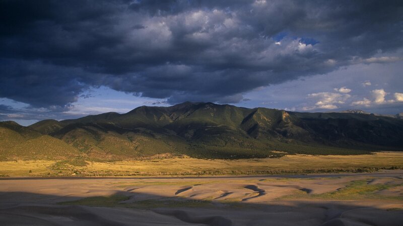 mountains under stormy sky