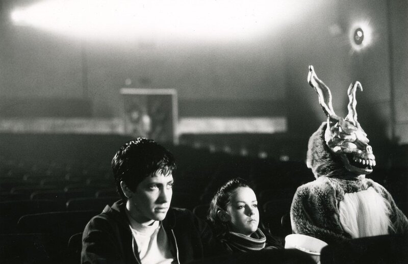 Movie theater scene with rabbit creature