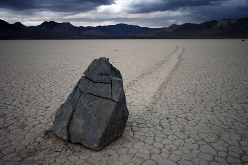 Moving rock in dry lake bed