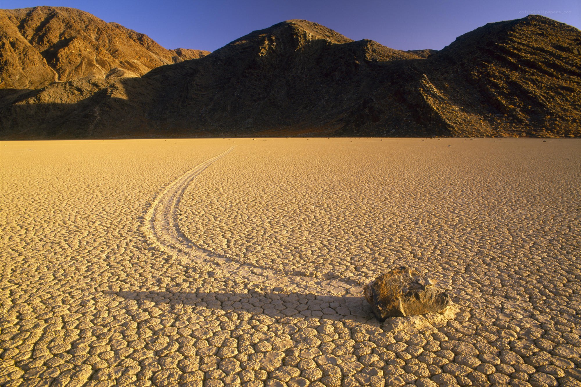 Moving rock on dry lakebed