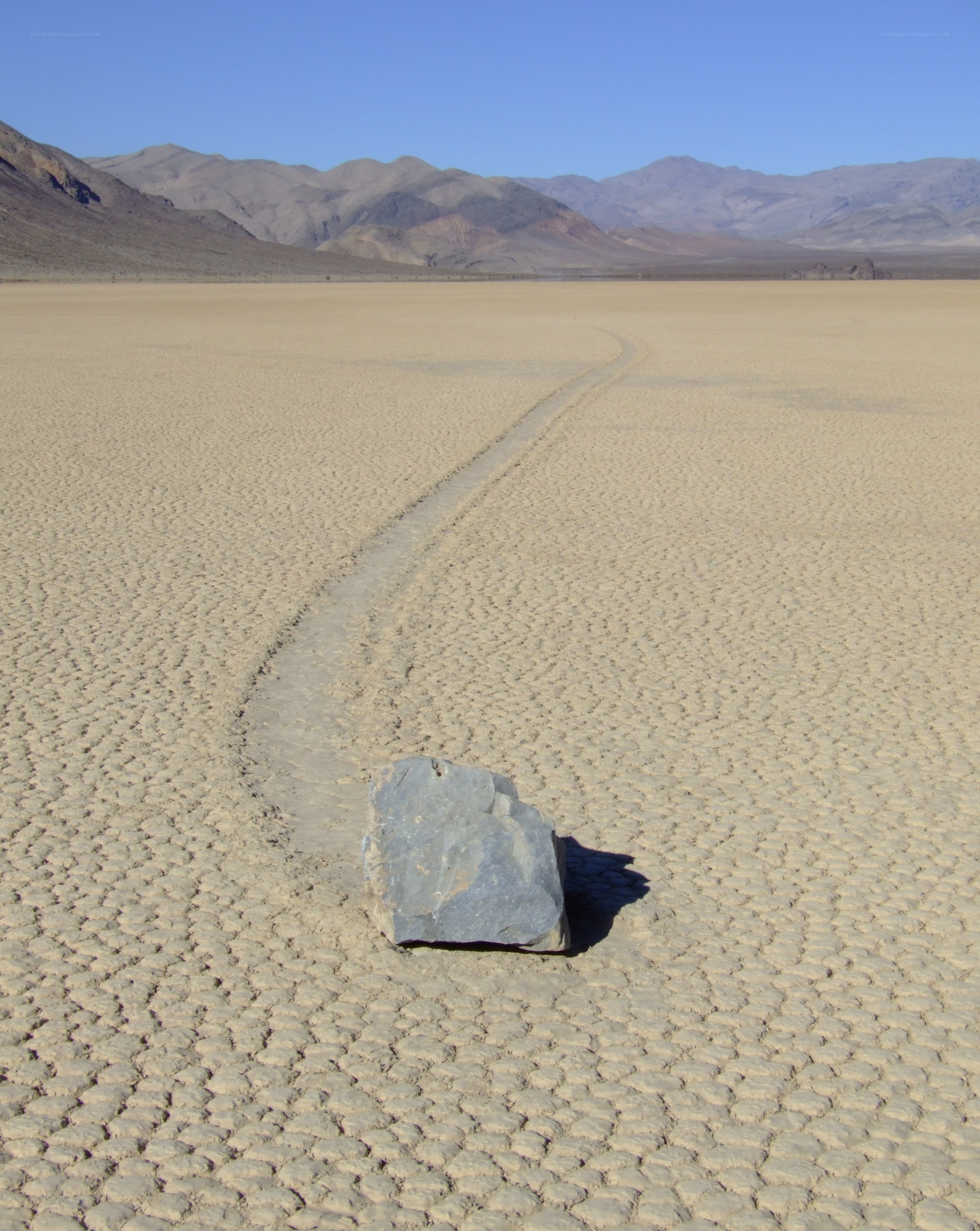 Moving rock on dry lakebed