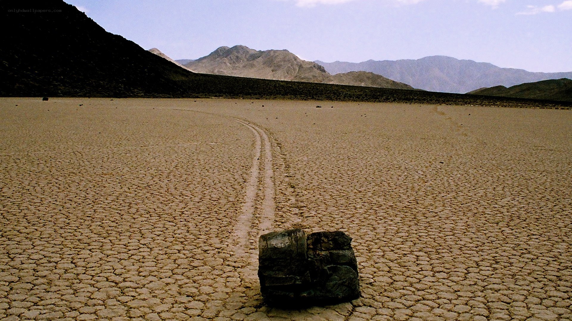Moving rock on dry lakebed