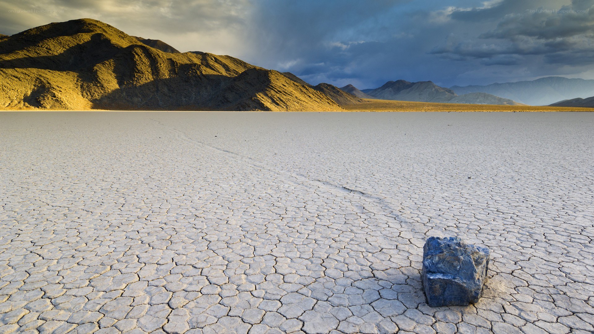 Moving rock on dry lakebed