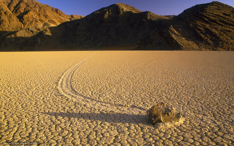 Moving rock on dry lakebed