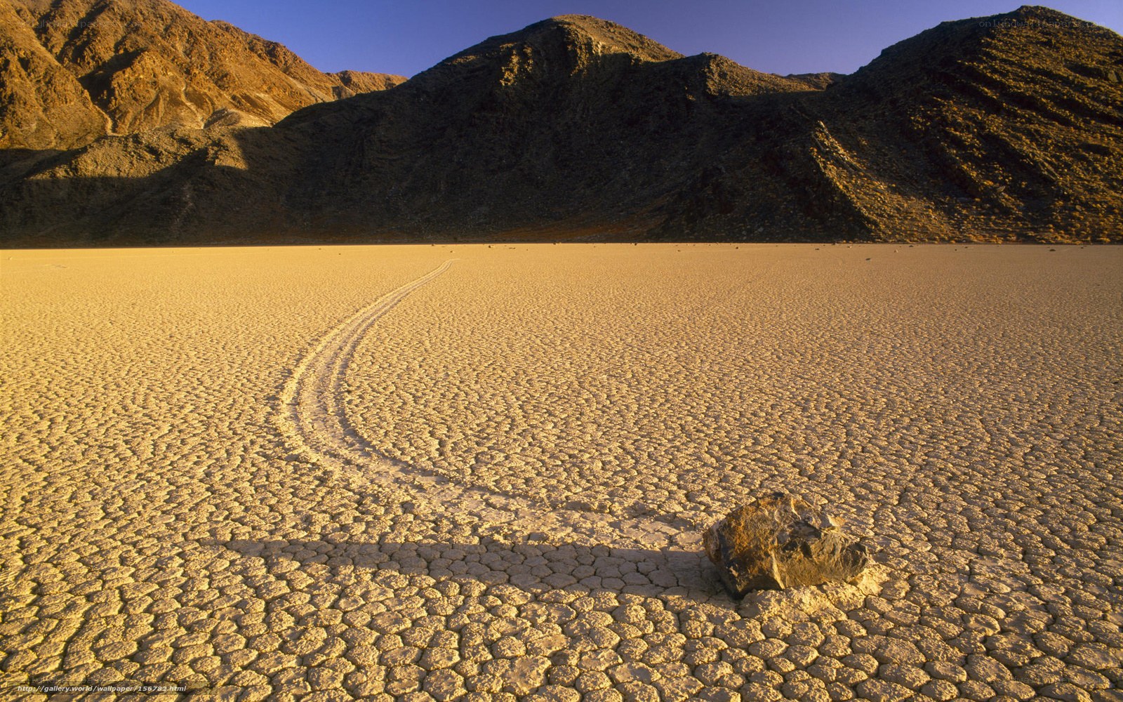 Moving rock on dry lakebed