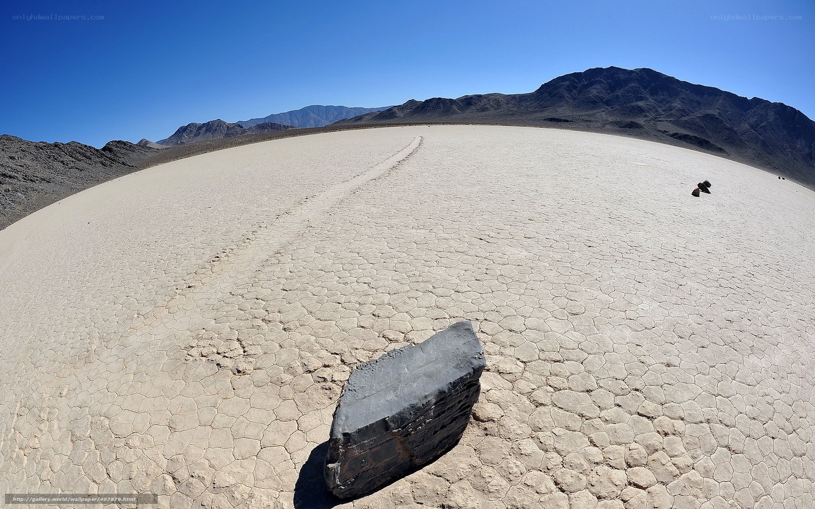 Moving rocks on a dry lake bed