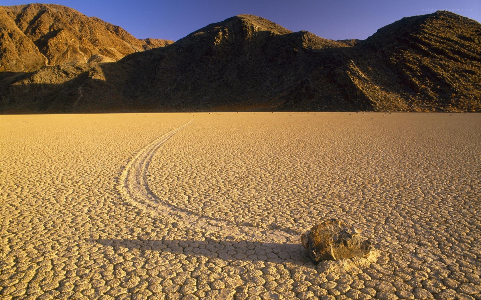 Moving rocks on a dry lakebed