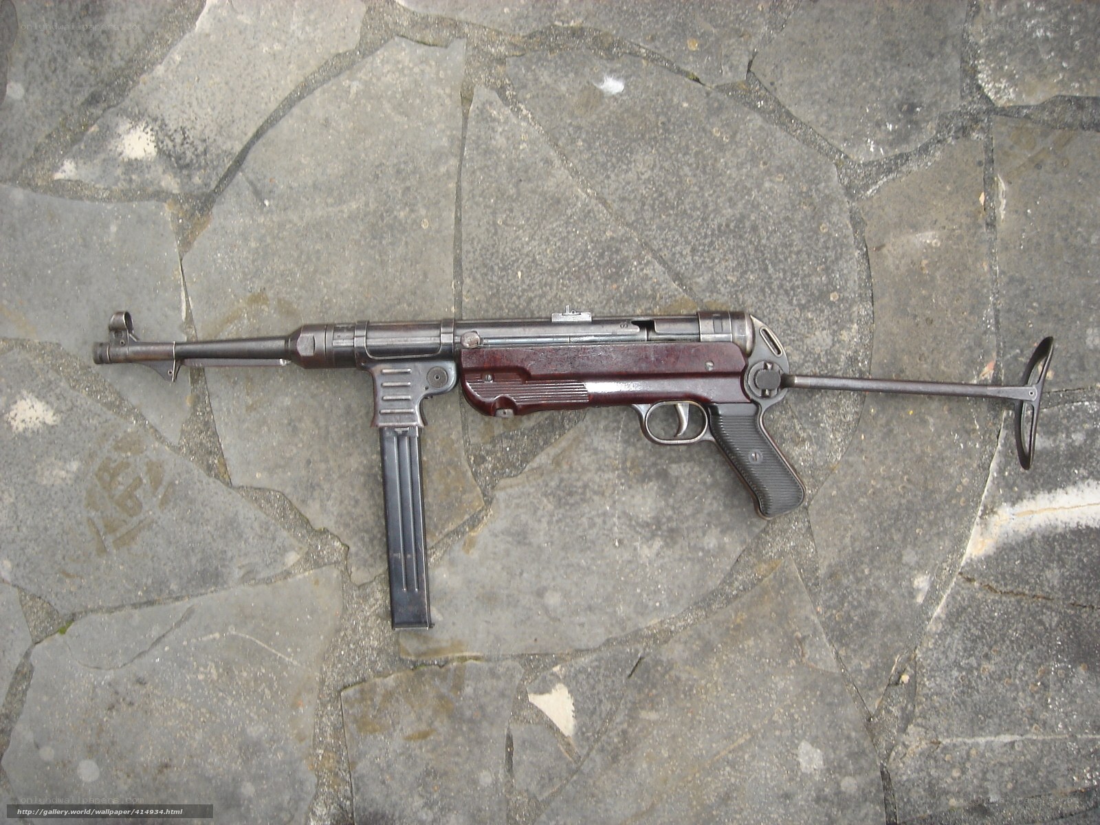 MP40 submachine gun on stone