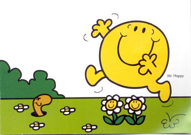 Mr. Happy jumping in a field