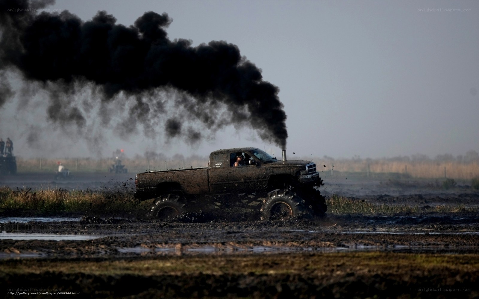 Mud truck racing in action