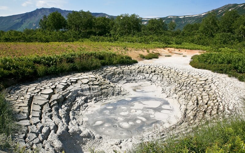 Mud volcano in a mountain valley