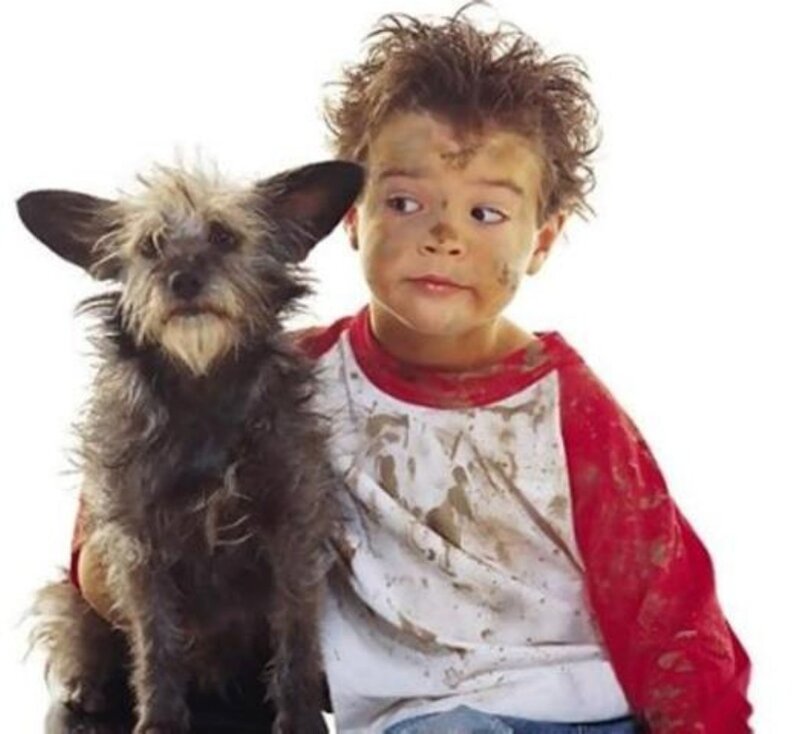 Muddy Child with Dog