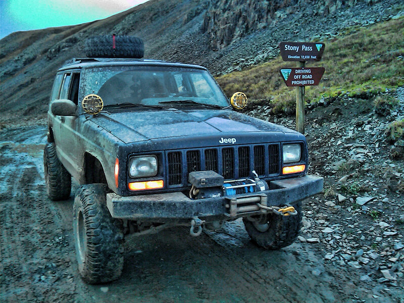 Muddy Jeep on Dirt Road
