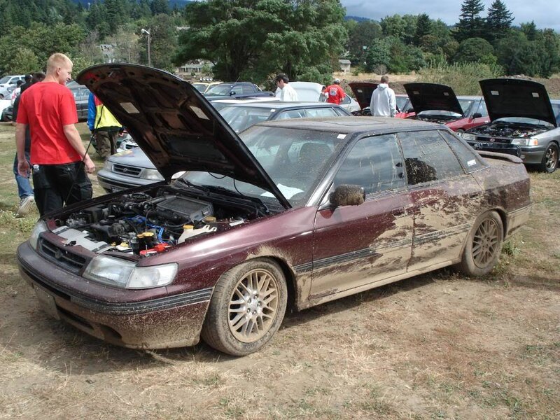 Muddy Maroon Sedan