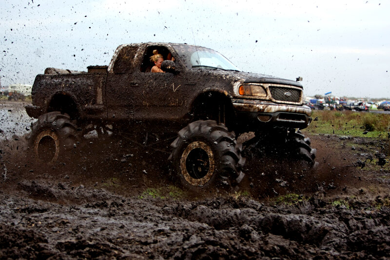 Muddy Monster Truck — Brown, Dramatic, Photograph, Person
