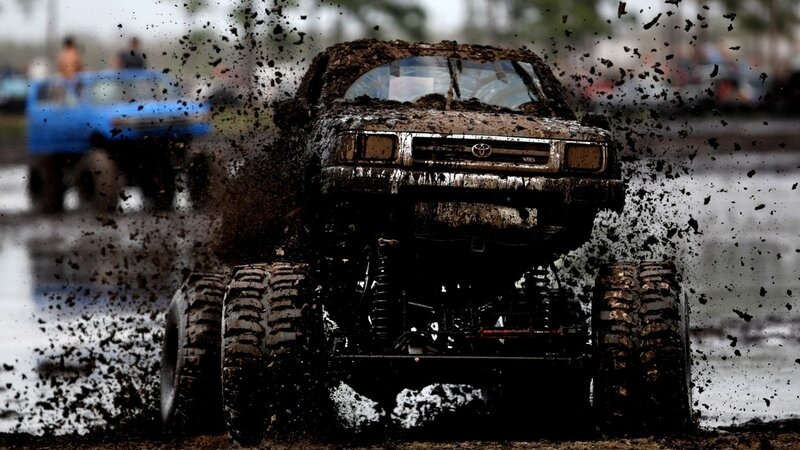 Muddy monster truck in action