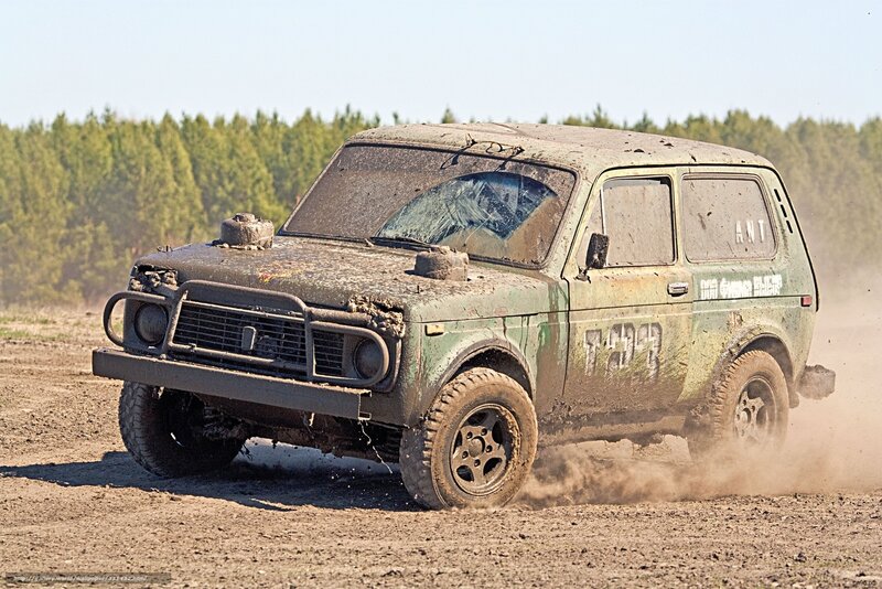 Muddy off-road vehicle in action