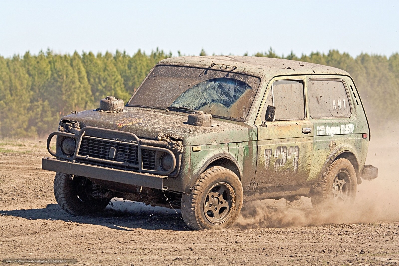 Muddy off-road vehicle in action