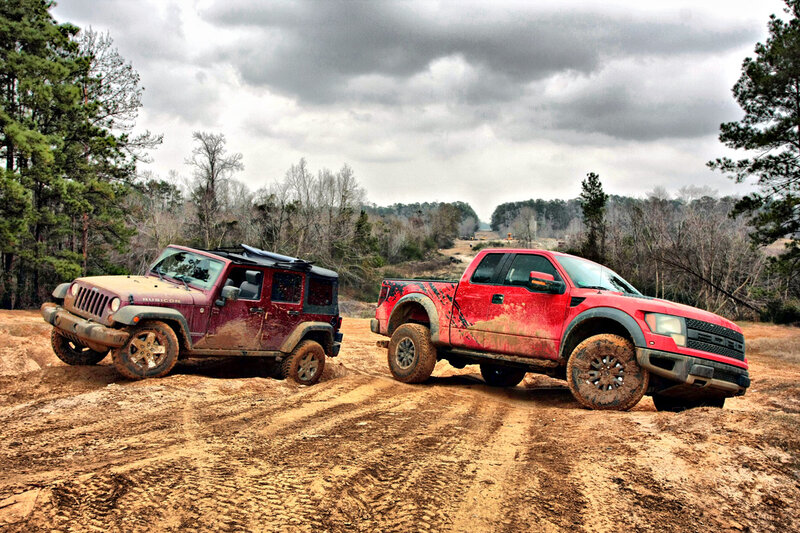 Muddy off-road vehicles in forest