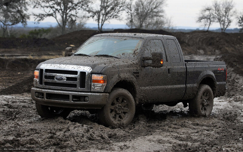 muddy pickup truck in mud