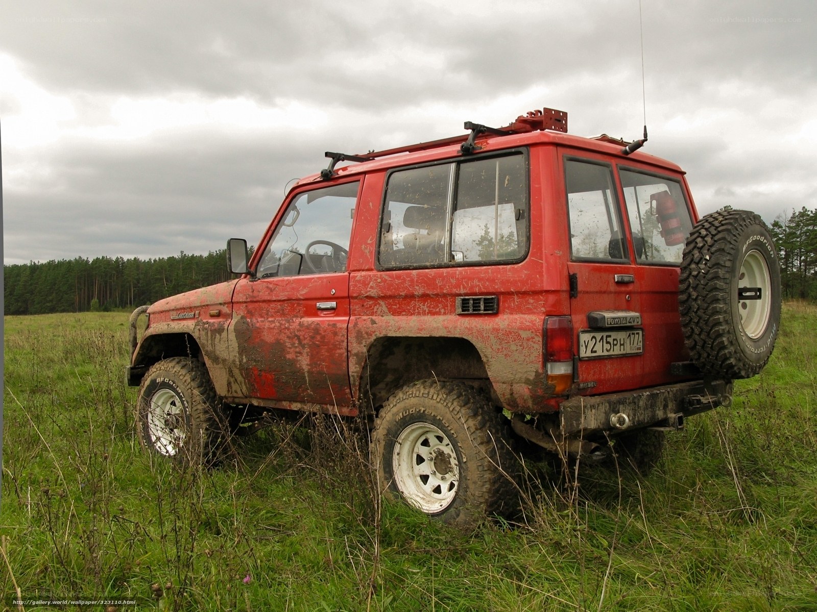 Muddy red off-road vehicle