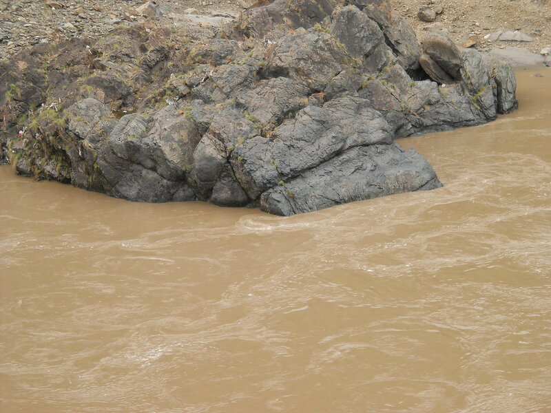 Muddy River with Rocks